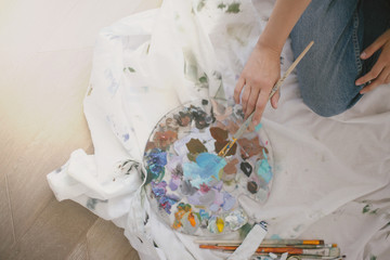 Woman painter drawing picture