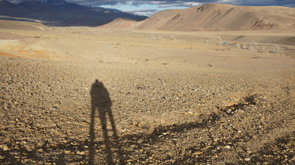 Shadows of people in the Altai mountains at sunset