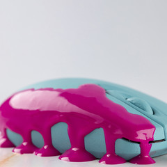 Turquoise mouse with dripping pink paint