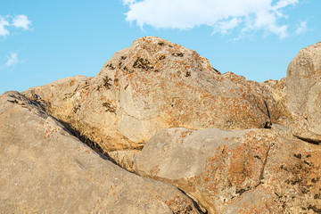 Fototapeta na wymiar Stones rocks rocky ground against the sky