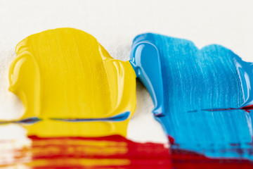 Yellow and blue paint with brush marks