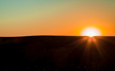 Sunrise in the steppe. Landscape minimalism