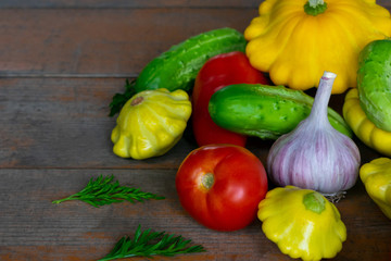 Vegetables on a wooden background close-up. Autumn rich harvest. Rural still life.