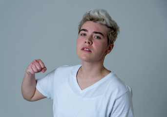 Portrait of a young teenager man with angry face looking furious.