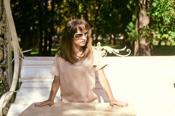 portrait of a woman on a park bench