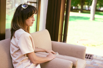 woman on a sofa near a restaurant
