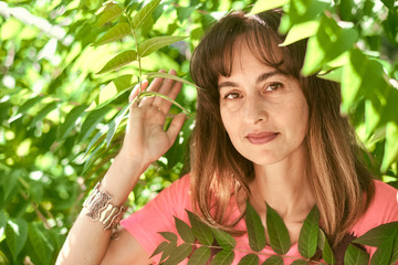 portrait of a woman in tree branches