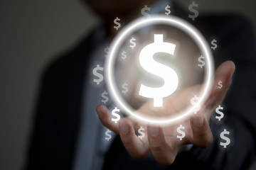 Businessman with protective gesture hand for dollar sign.US dollar is main and popular currency of exchange in the world.Investment and saving concept.