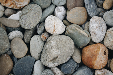 Fototapeta na wymiar Abstract smooth round pebbles sea texture background