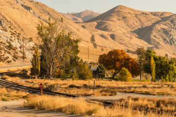 Train tracks at dawn along the Columbia River as it passes through Entiat
