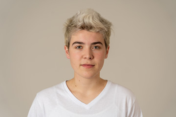 Natural portrait of young handsome transgender boy posing with neutral face expression - obrazy, fototapety, plakaty