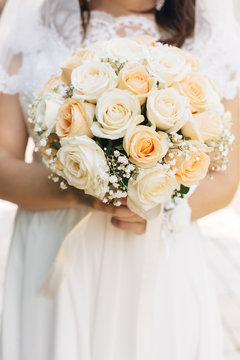 Wedding image and a bridal bouquet with red flowers	
