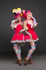 Pretty women in original hats and dresses view