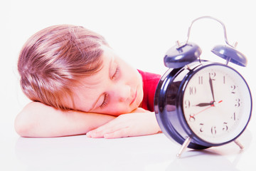 Time to sleep. Portrait of little cute sleeping child girl with clock.