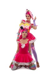 Obraz na płótnie Canvas Playful dancers in original hats and dresses view