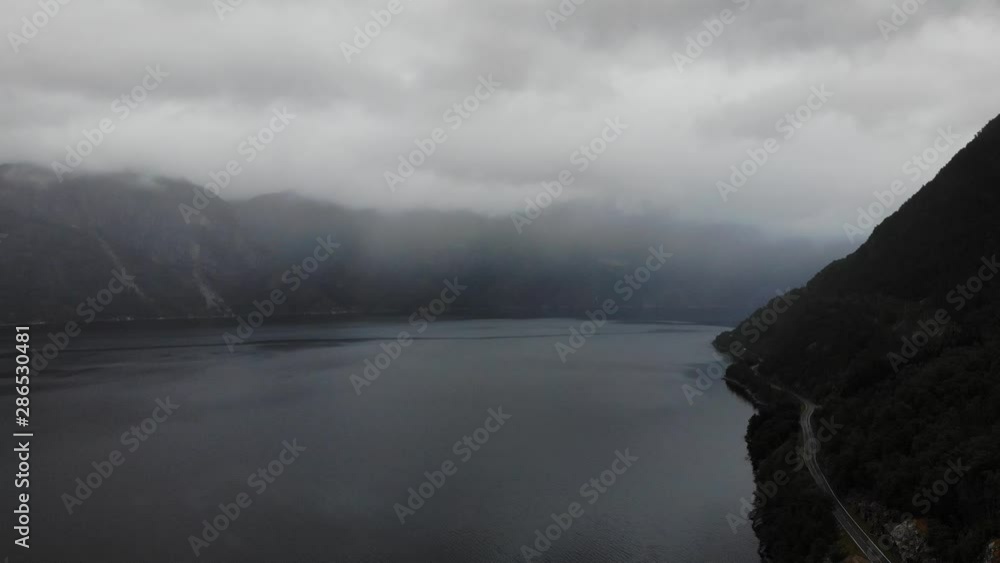 Sticker aerial view. norwegian evening landscape. mountains and fjord eidfjorden on overcast weather