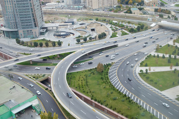 Bridges, roads. Top view . Aerial view of highway and overpass in city .Aerial photo of urban elevated road junction and interchange overpass in city with light traffic