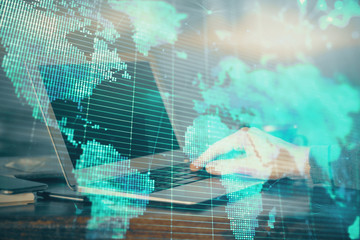 Multi exposure of businessman working on laptop on background. International business hologram in front. Concept of success.
