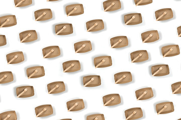 Ecological paper utensils, naturally decomposed materials. Plates and wooden forks, natural picnic set, repeating pattern background.