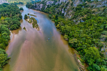 Aerial view of adventure team doing Kayaks