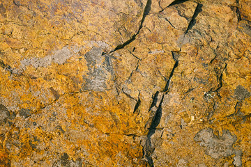 The surface of rock illuminated by the sun on the side