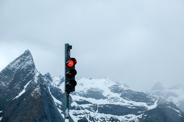 red traffic light. Norway mountain over Lysefjord. Natural scandinavian landscape
