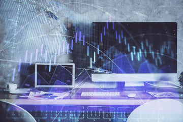 Financial graph colorful drawing and table with computer on background. Double exposure. Concept of international markets.