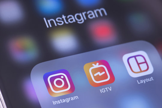 Instagram, IGTV and Layout apps icons on the screen smartphone. Instagram - free application for sharing photos and videos with the elements of a social network. Moscow, Russia - October 14, 2018