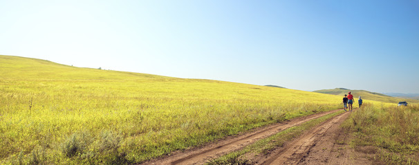 road in the field and people