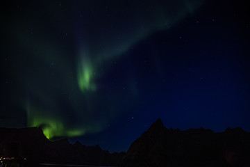 Obraz na płótnie Canvas Northern lights above Reine in Lofoten islands in Norway