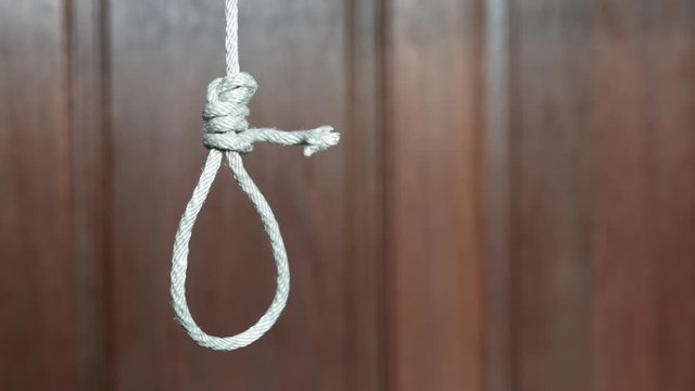 commit suicide concept, Hangman's noose knot hang from the ceiling