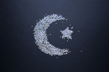 Ramadan Kareem dark black greeting backgroud. Crescent of sequins. Top view