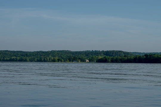 With the camsite in the distance the lake at Eucha Oklahoma is calm and inviting. Bokeh.