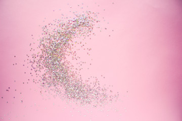 Golden stars glitter on pink background. Flat lay