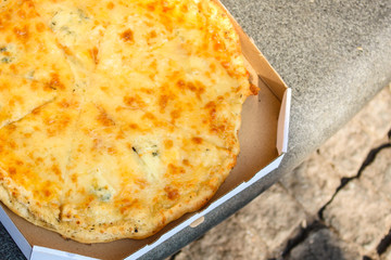 pizza in box (fast food, cheese, tomato sauce and other ingredients) concept, street food. food background. copy space