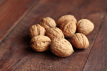 Walnuts isolated on the old wooden background