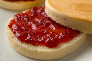 Dutch beschuitbollen with strawberry jam