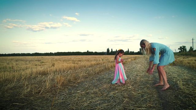 Games in the dry field. Large hay field