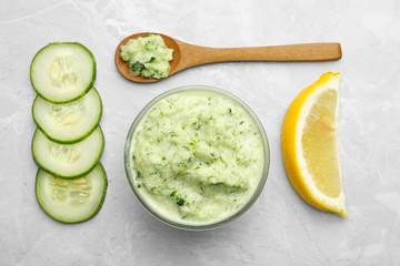 Handmade face mask and fresh ingredients on light marble table, flat lay