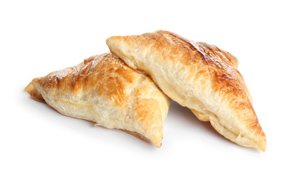 Fresh delicious puff pastry on white background