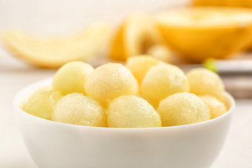 Bowl of melon balls on table, closeup