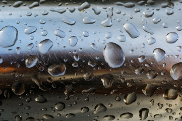 The rain drops on stainless steel