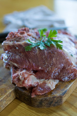 fresh veal chop meat on wood