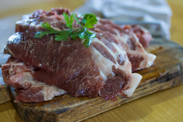 fresh veal chop meat on wood