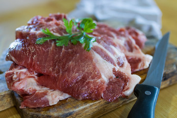 fresh veal chop meat on wood