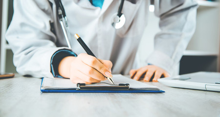 woman  doctor working in document .