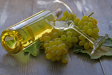 Grapes, white wine and glass