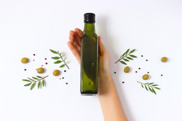 olive oil in a bottle on a white background top view.