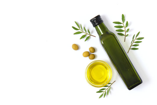 olive oil in a bottle on a white background top view.