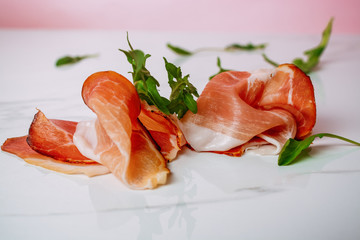 Slice of smoked ham on a white background